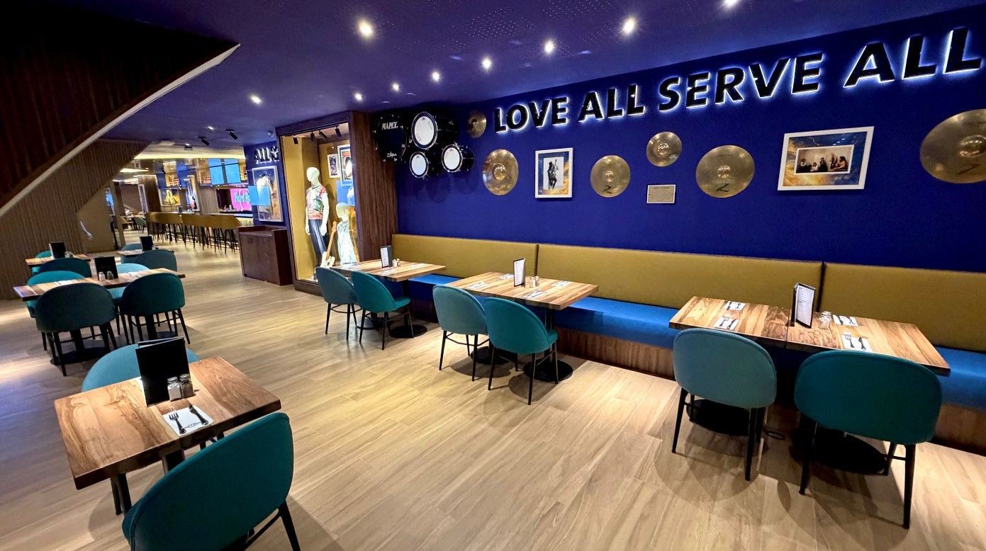 Modern restaurant interior with blue accent wall