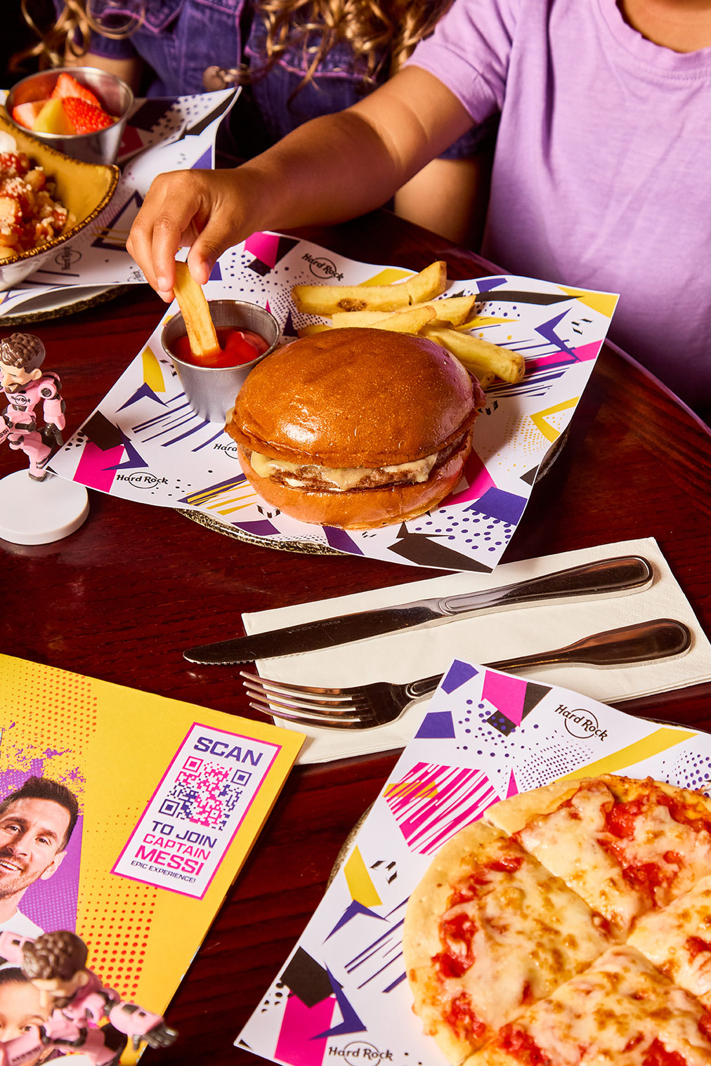 a burger and fries on a table