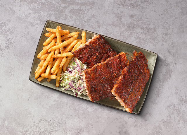 Baby Back Ribs a plate of ribs and fries