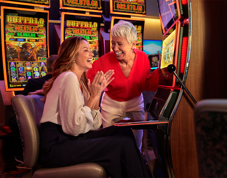 couple of friends playing slots couple of friends playing slots