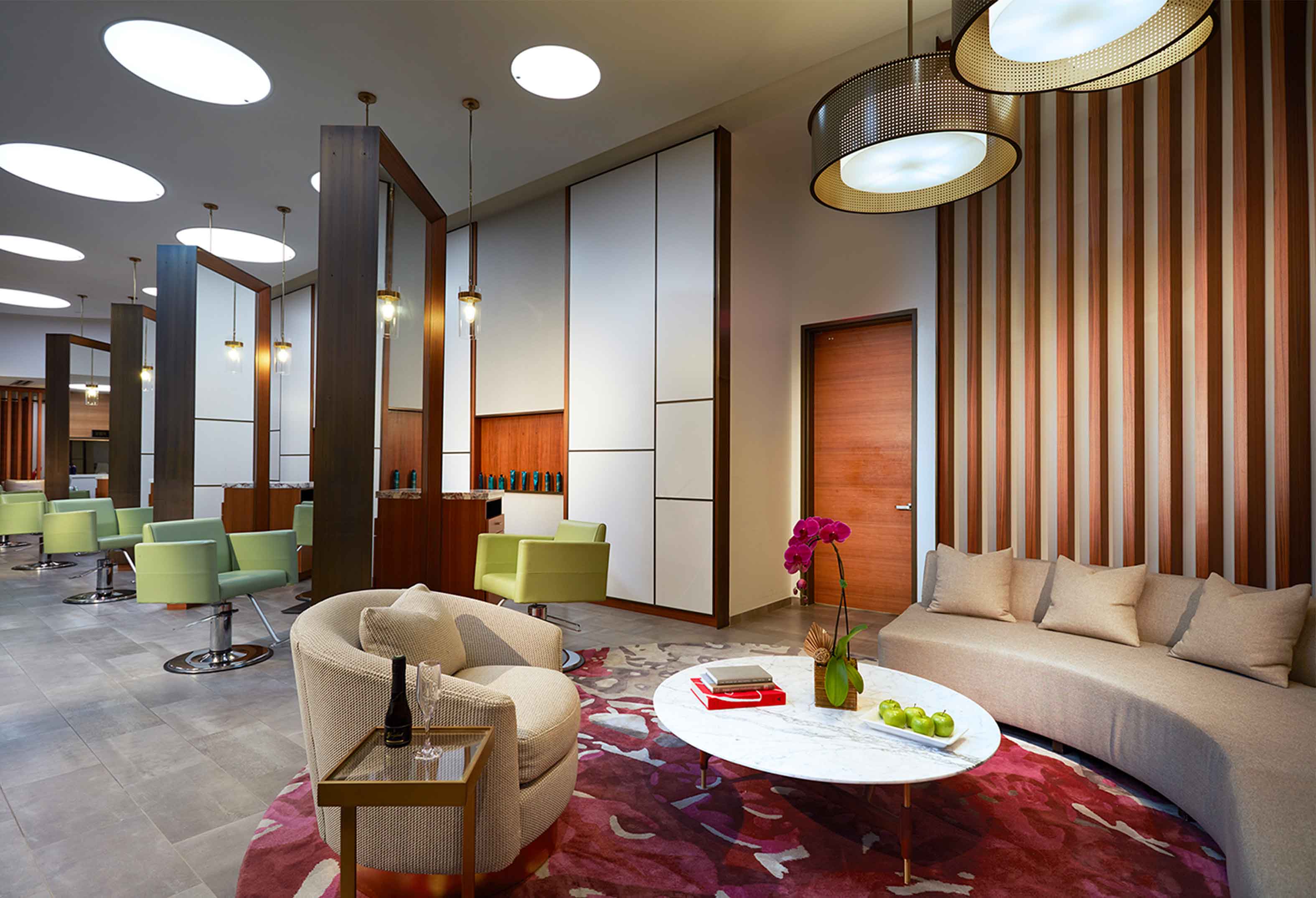 Salon chairs and couch seating area at Rock Spa & Salon