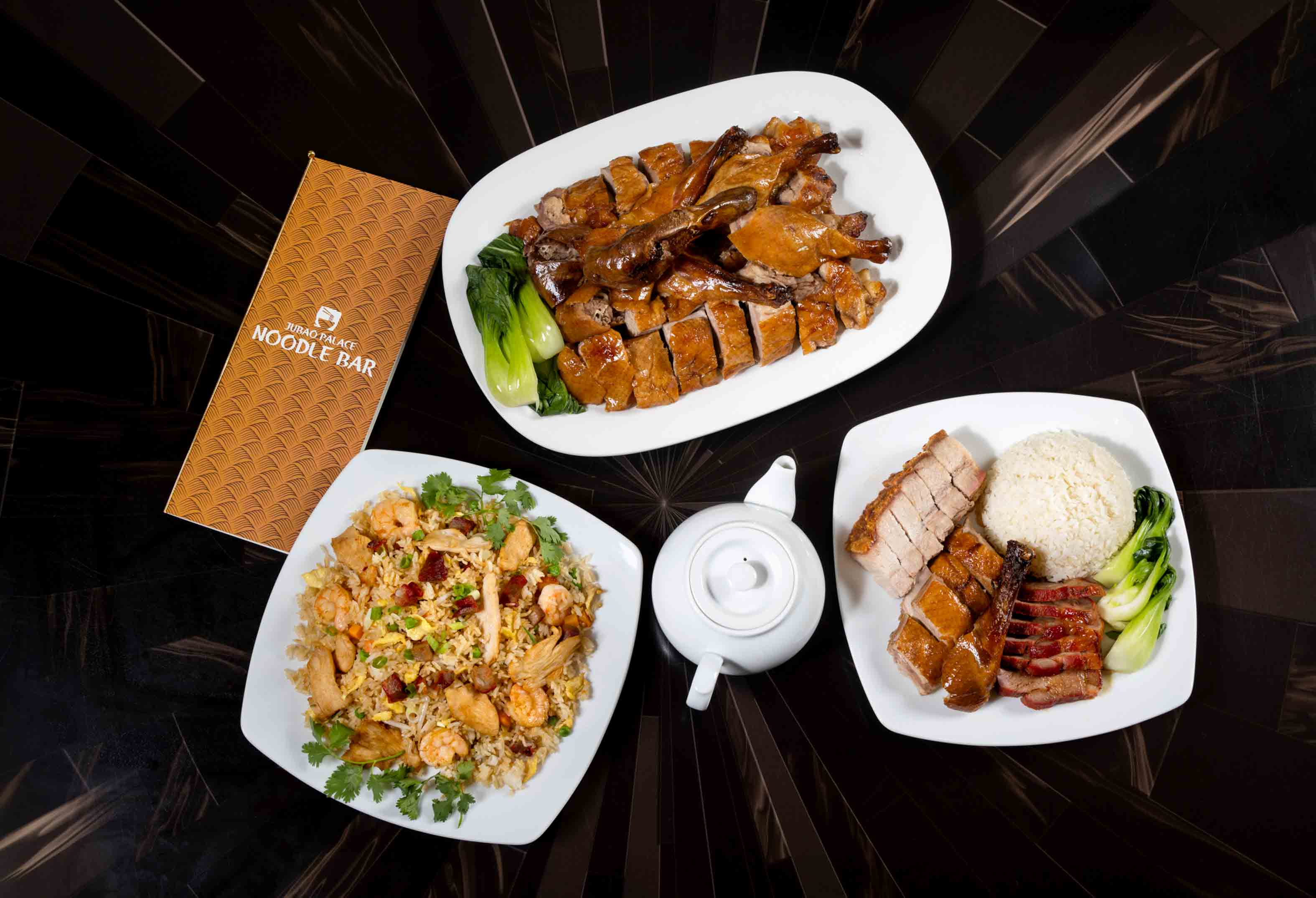 Table of Food at Jubao Palace Noodle Bar