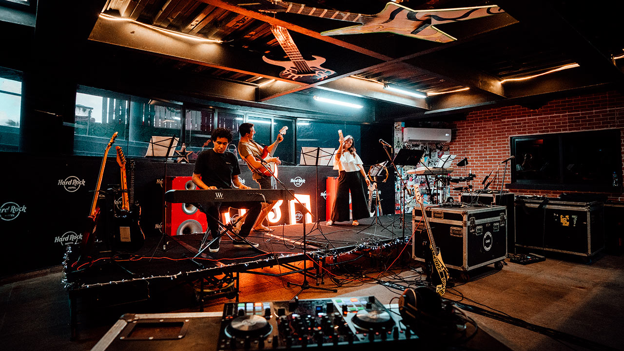 a group of people playing instruments on a stage