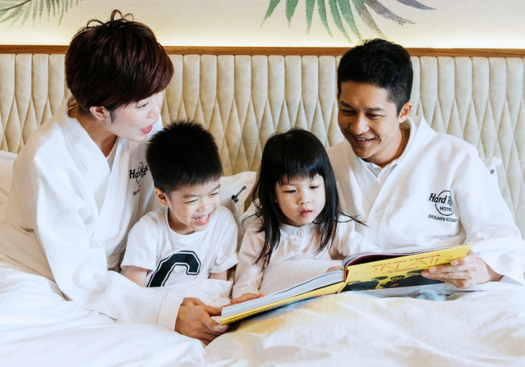 a family reading a book together