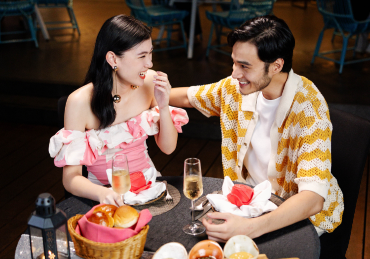 a man and woman sitting at a table