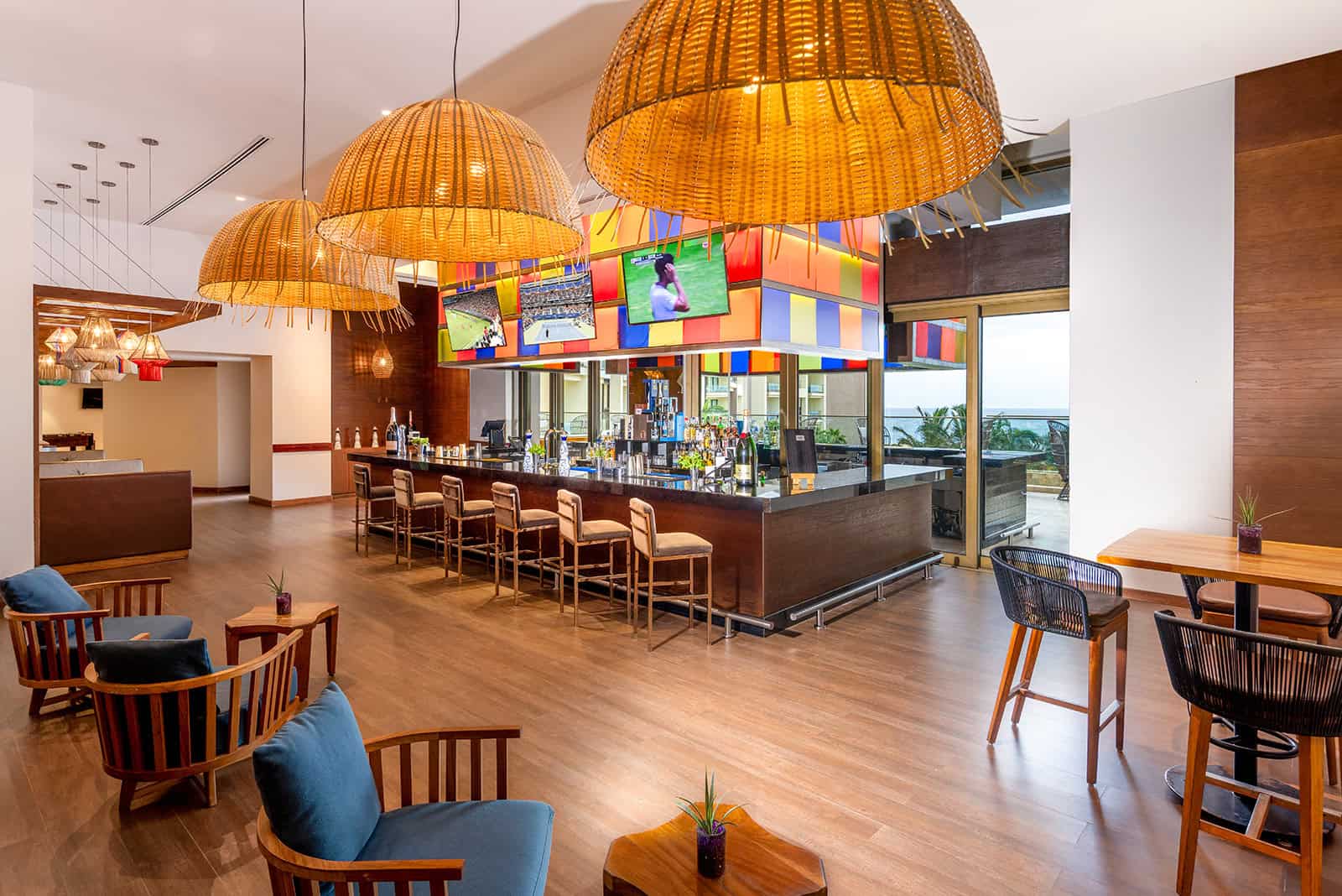 a room with a bar and chairs