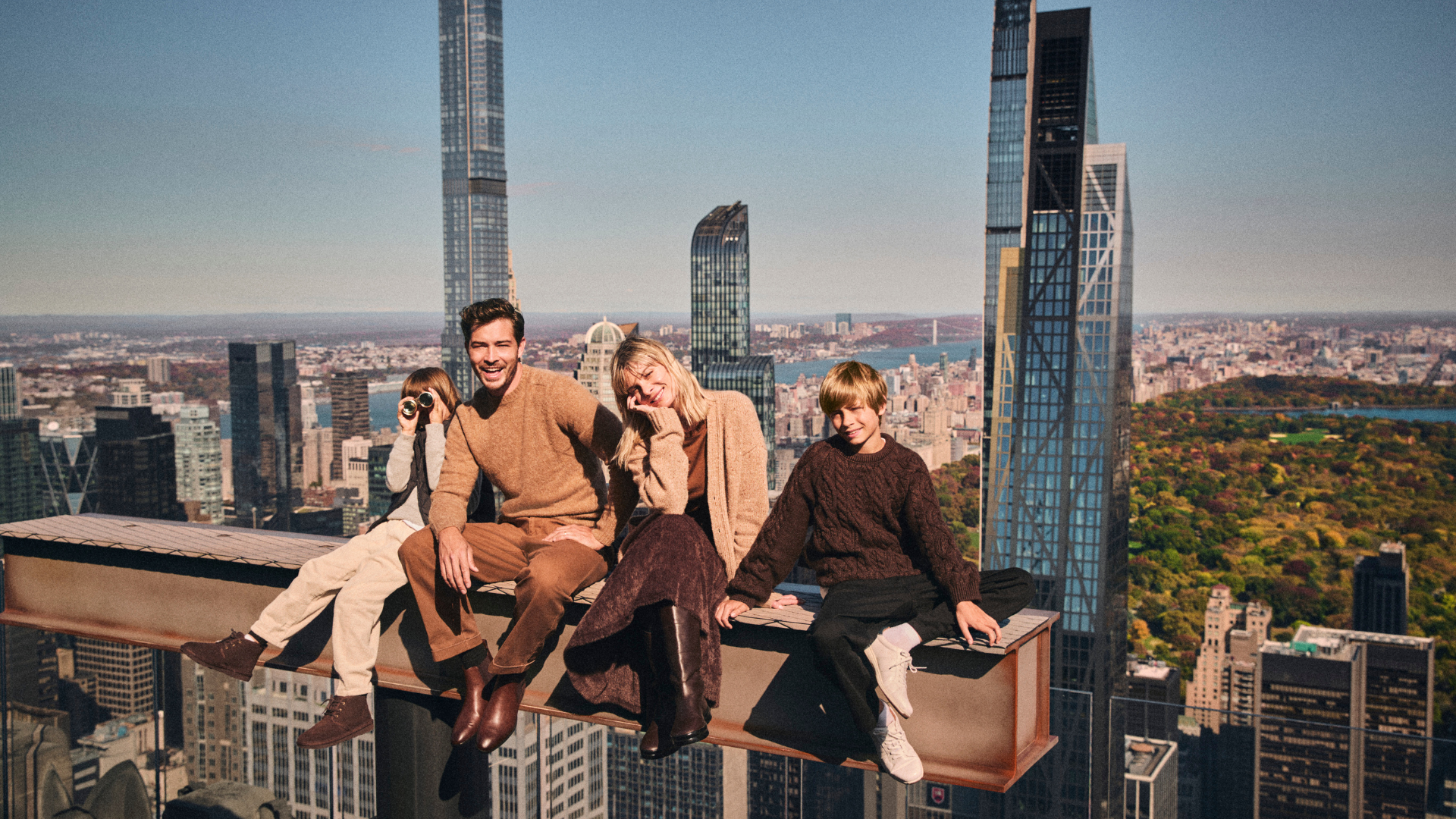 Family enjoying The Beam at Top of the Rock