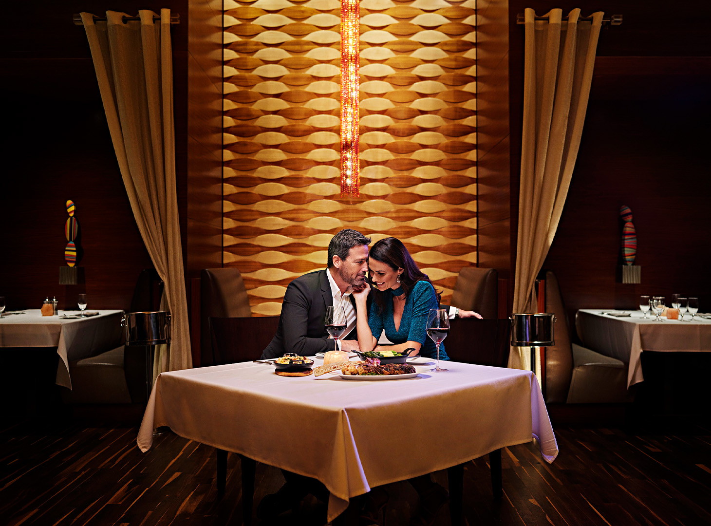 Flirty couple at dinner table